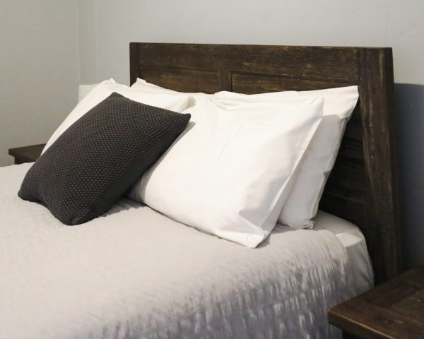 A cozy bed showcasing accommodation options at Royal Capertee Hotel